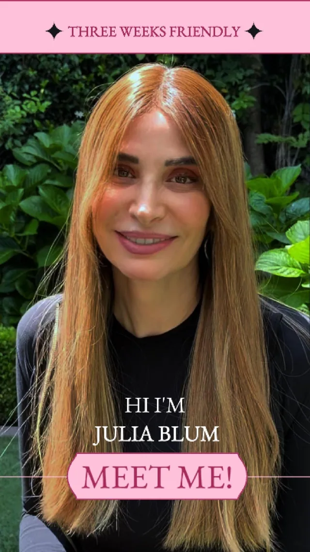 Julia Blum smiling outdoors in a garden, inviting viewers to meet her